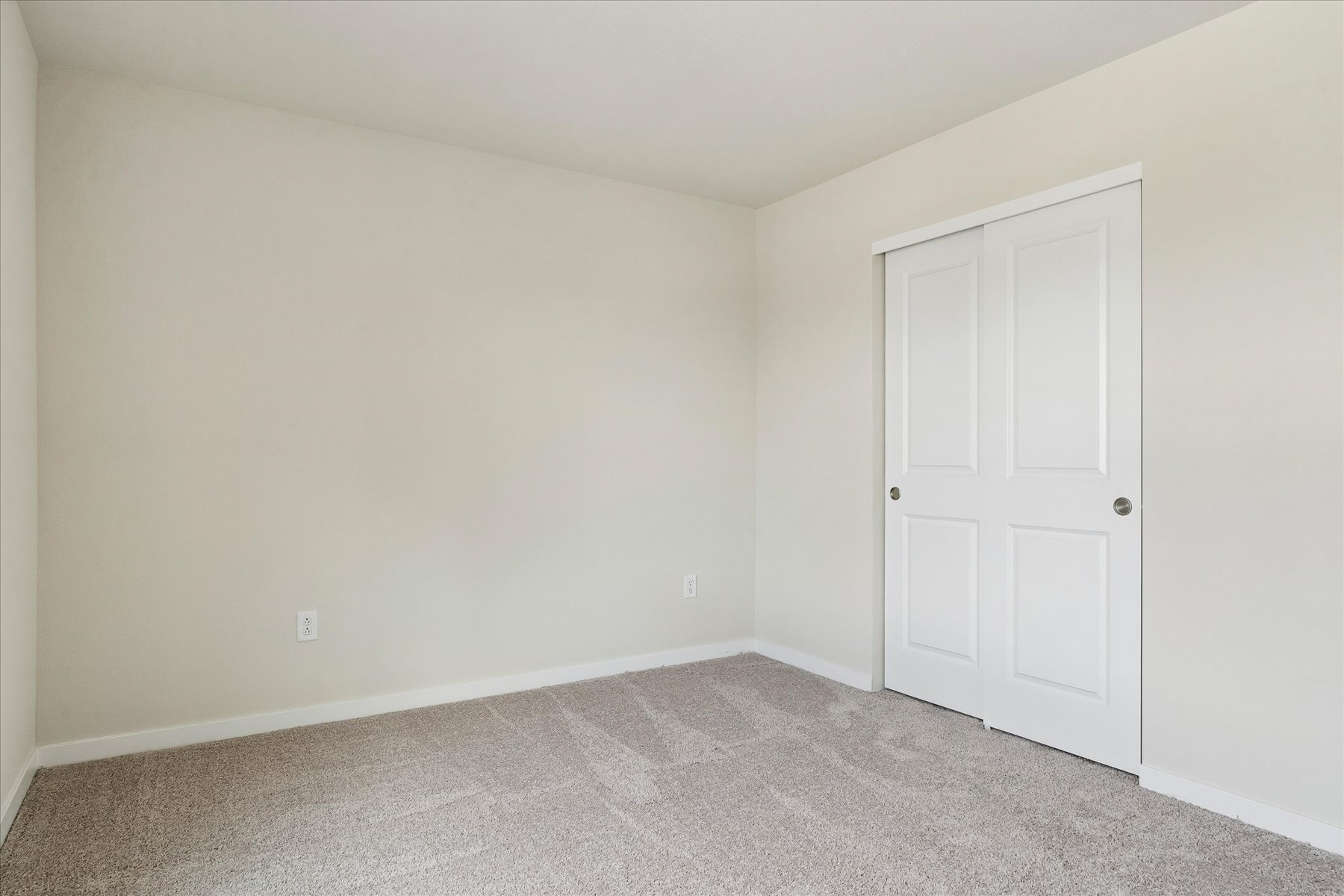 A room with white doors.