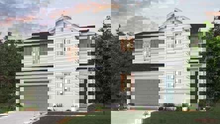 A white house with a garage.