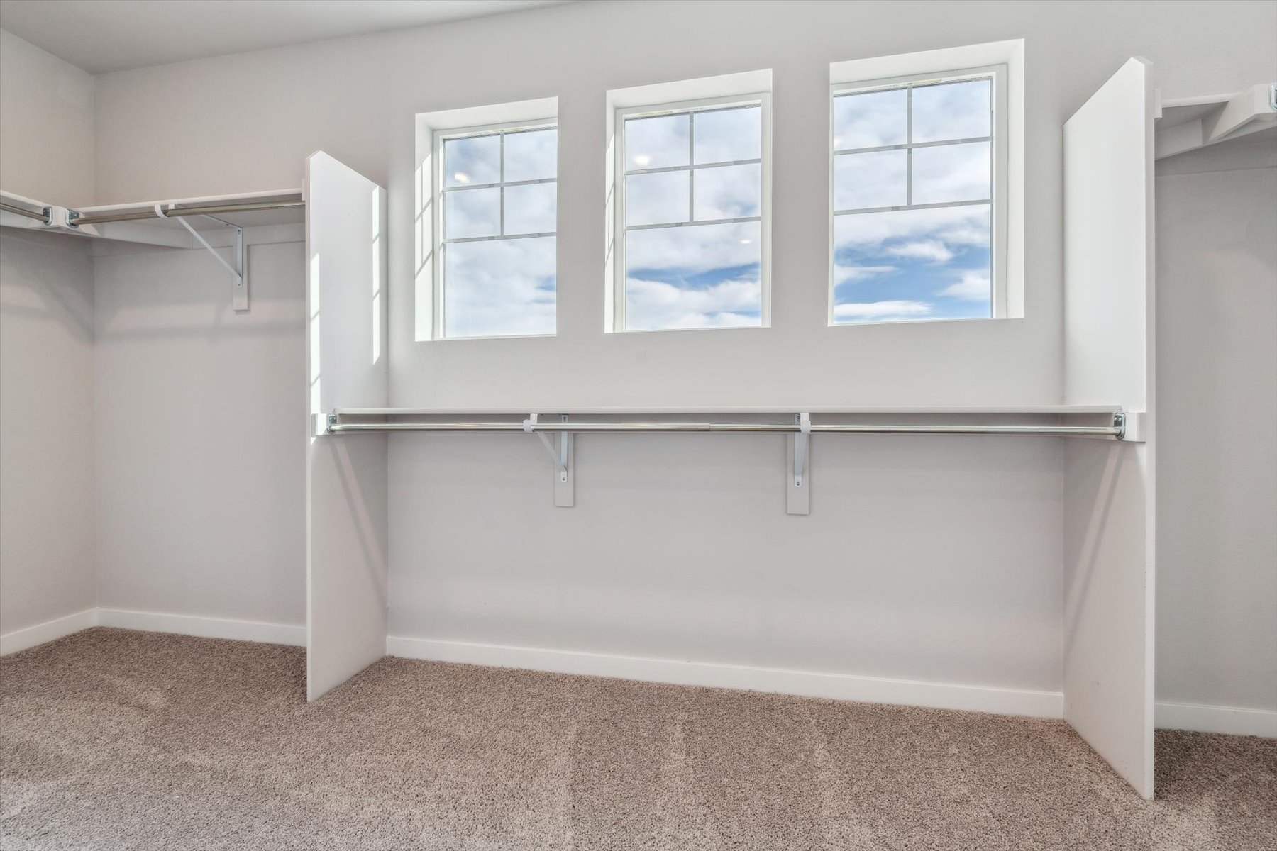 A white wall with windows.