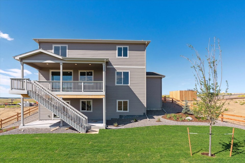 A house with a large front yard.