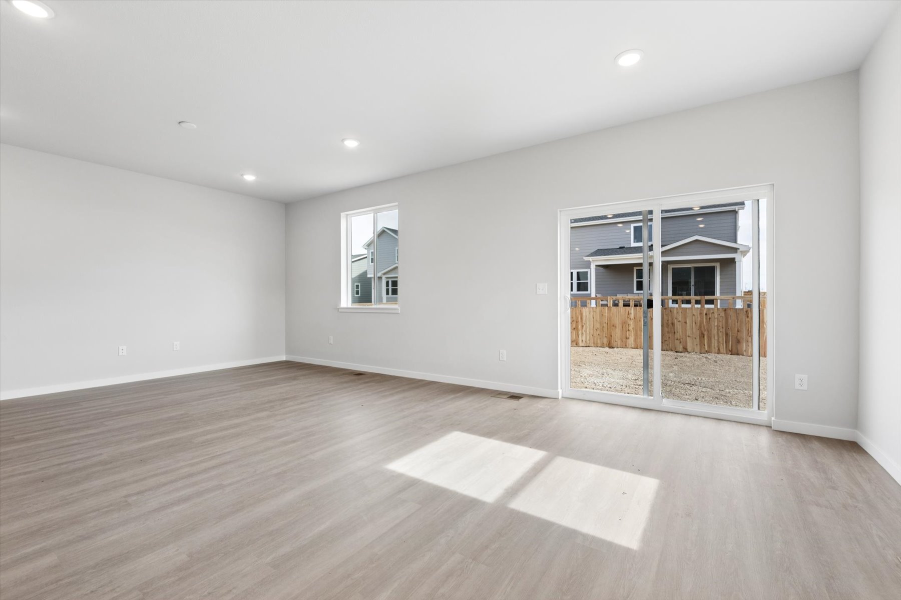 A room with a wood floor and a wood floor.