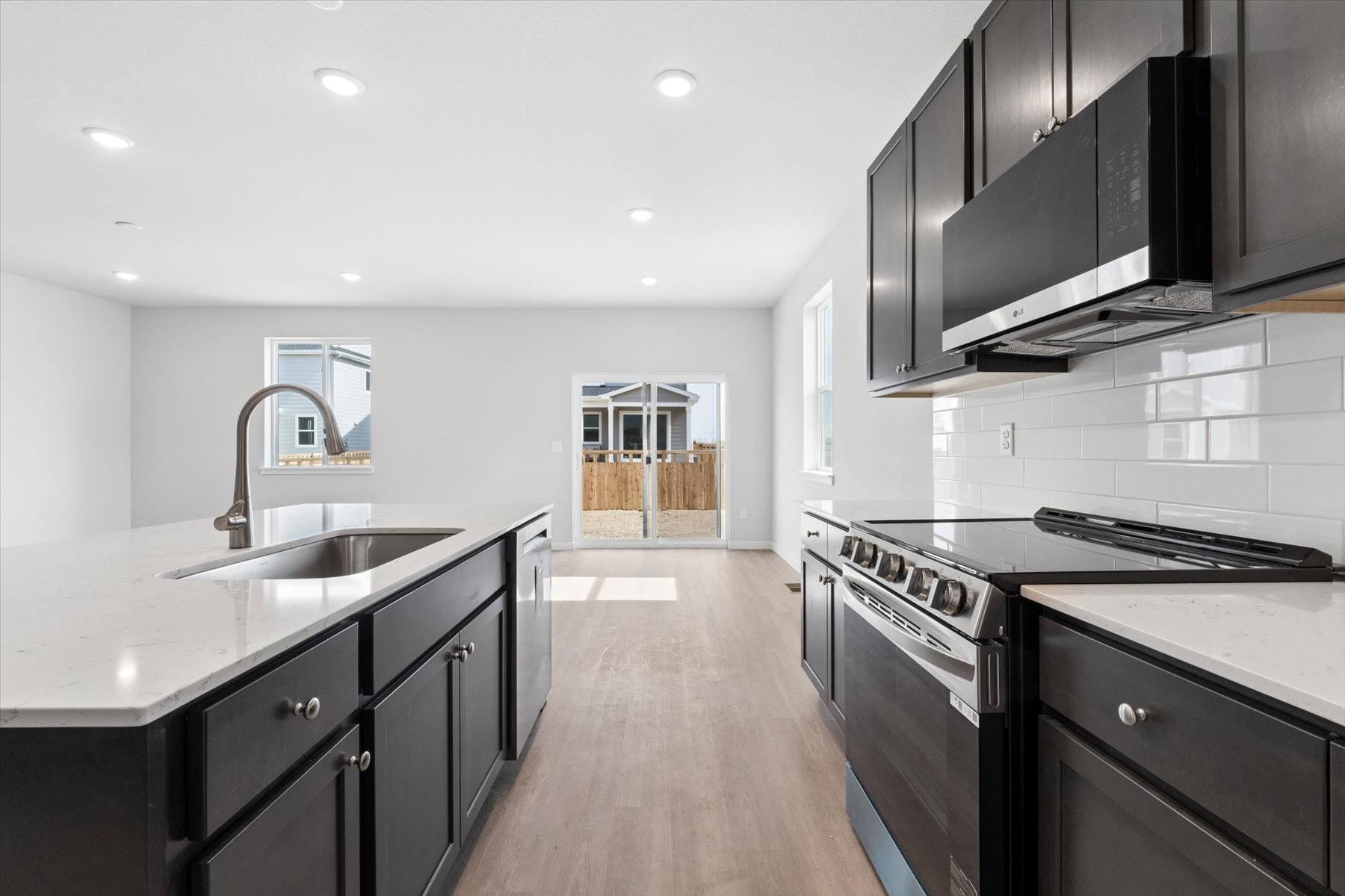 A kitchen with black appliances.