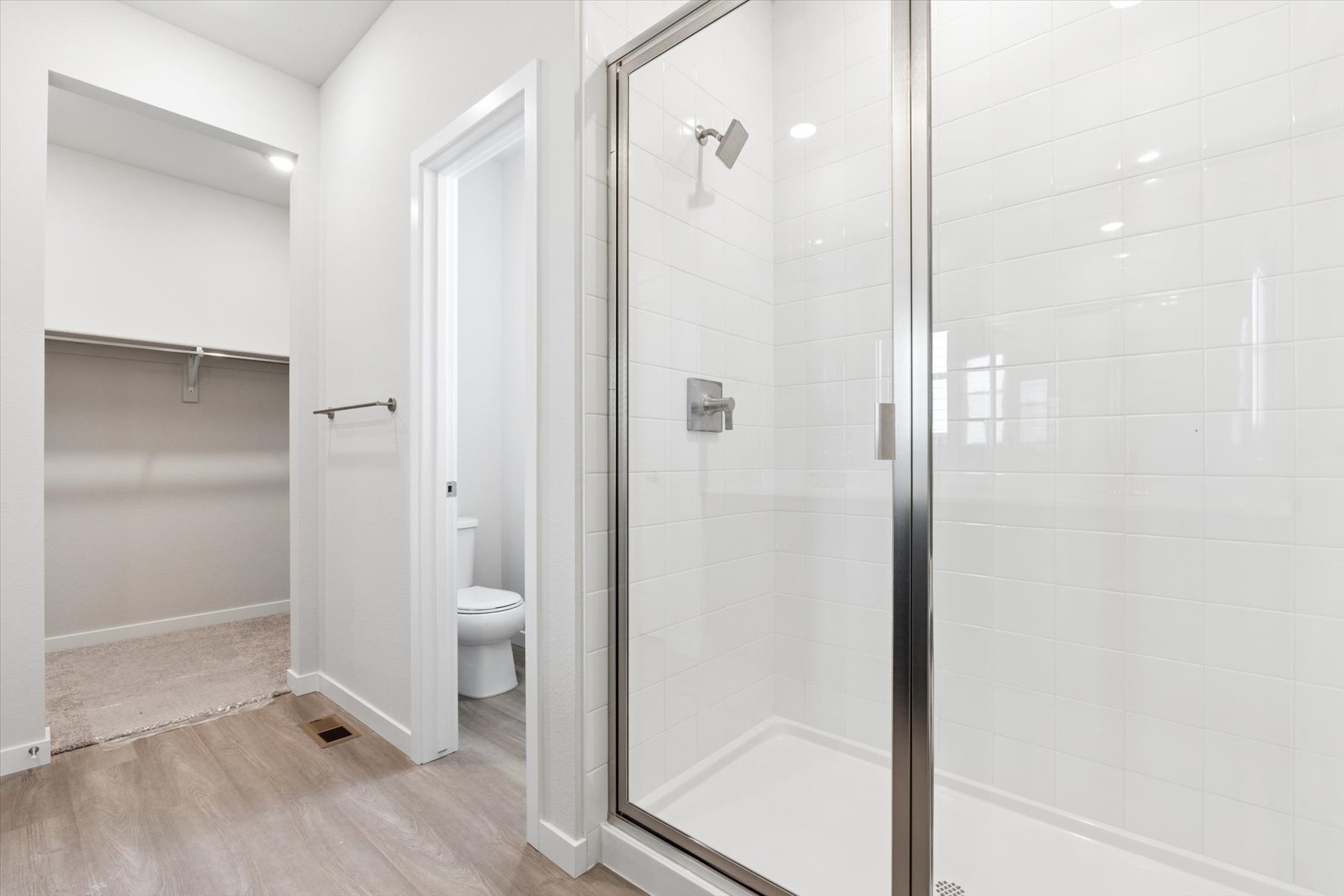 A bathroom with a glass shower.