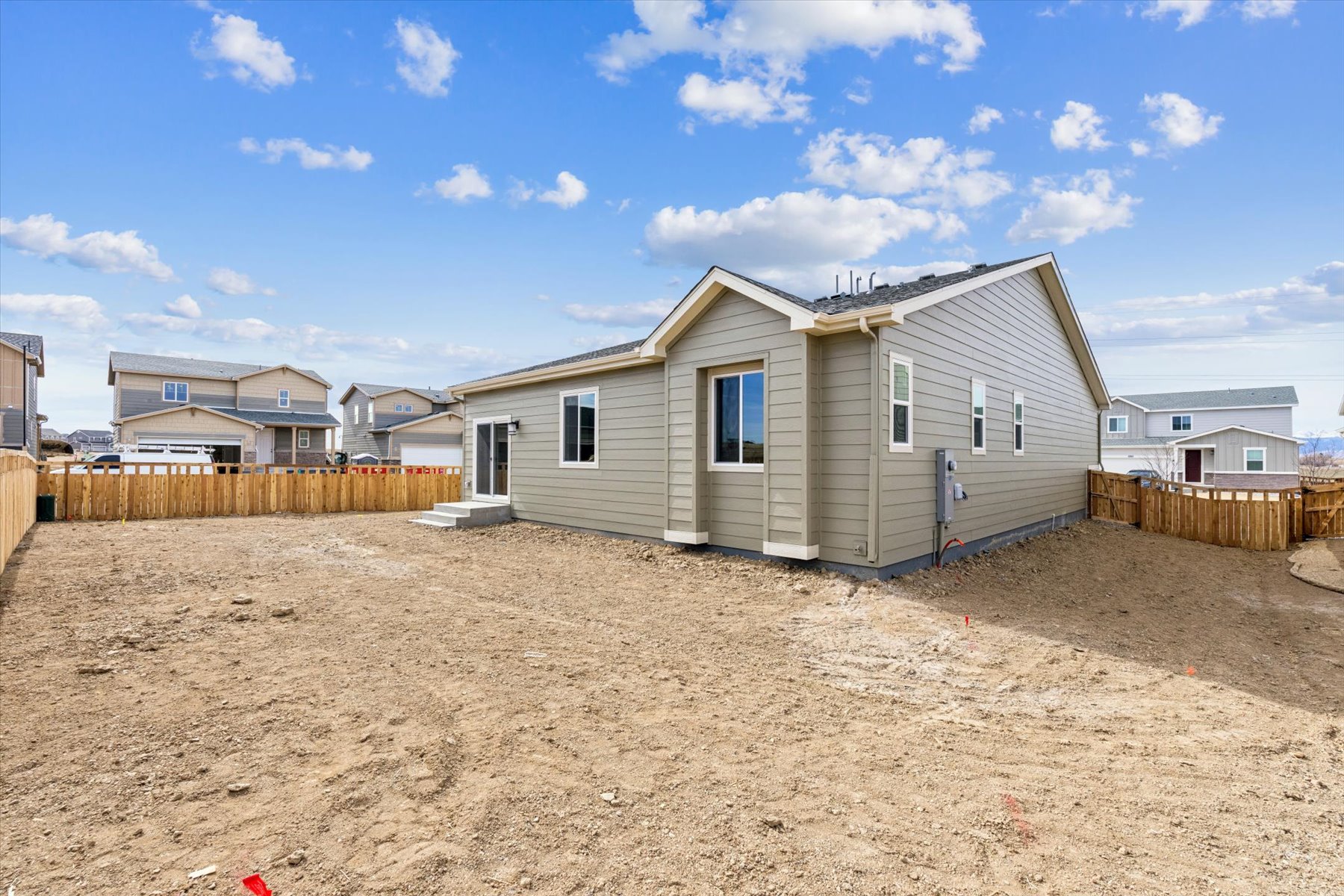A house with a dirt yard.