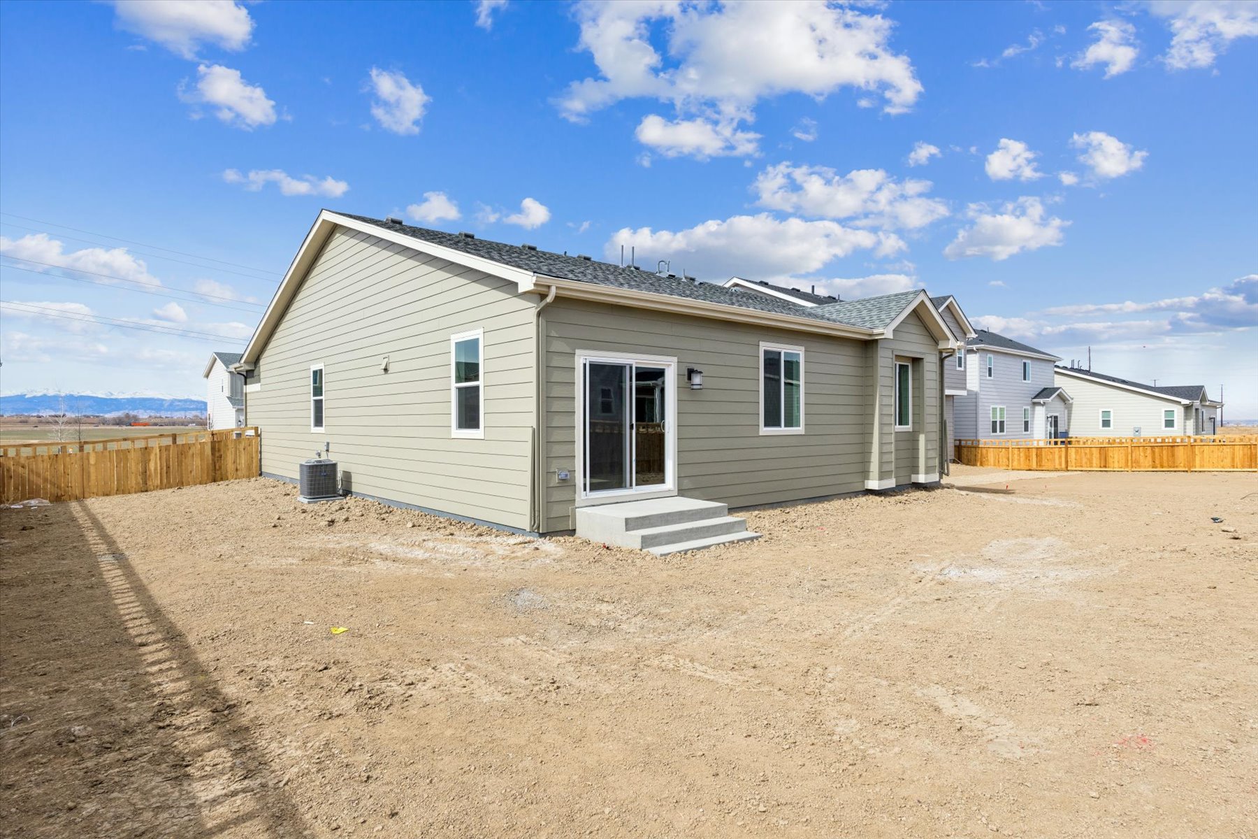 A house with a dirt yard.