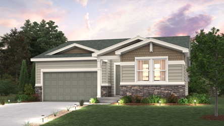 A house with a garage and trees.