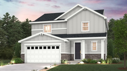 A white house with a driveway.