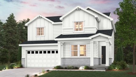 A white house with a driveway.