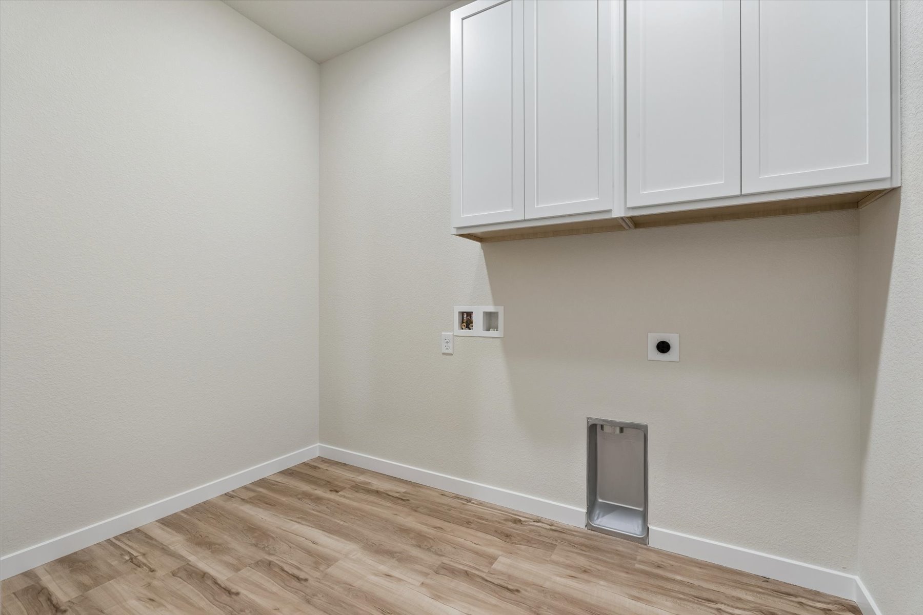 A room with white cabinets.