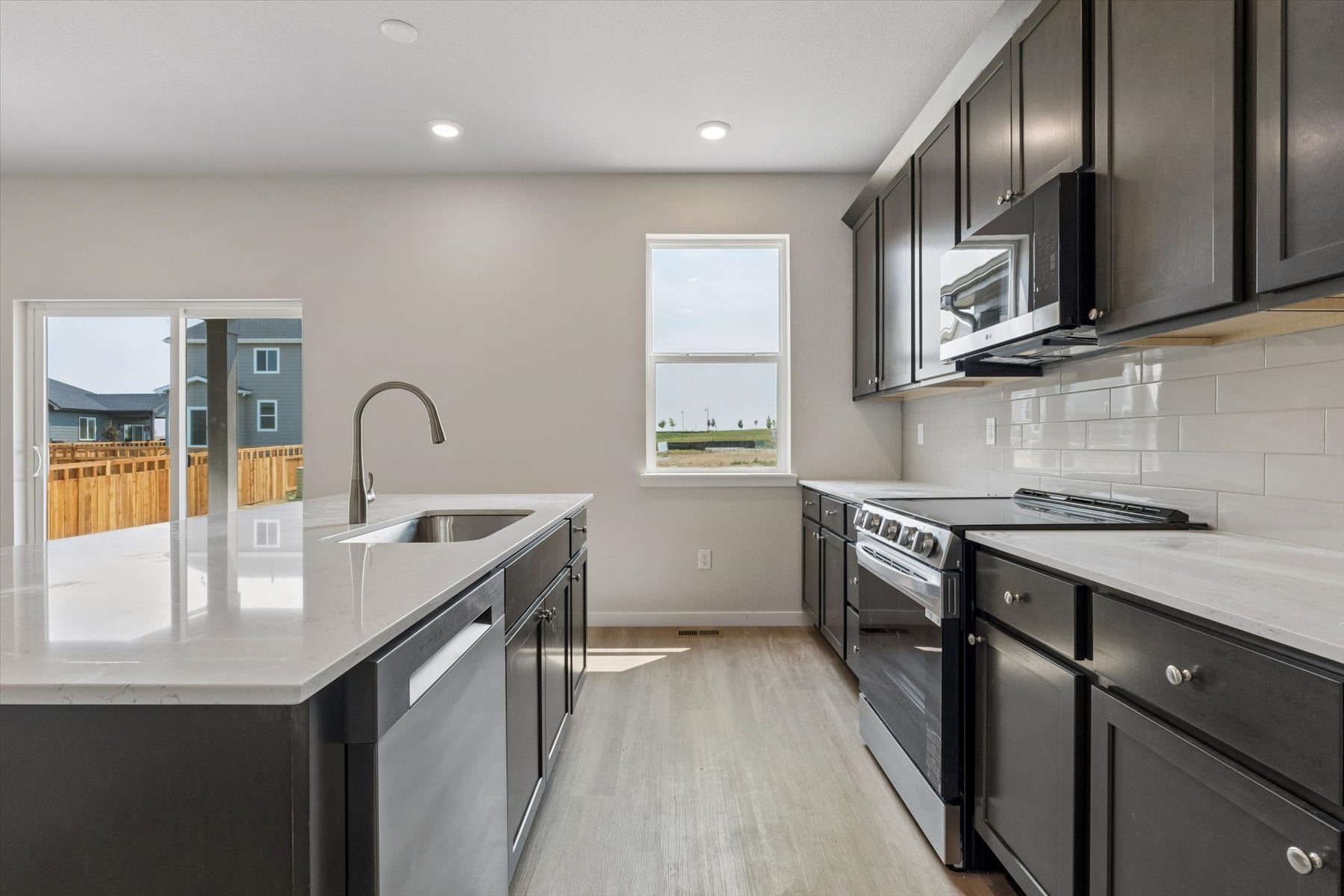 A kitchen with black appliances.