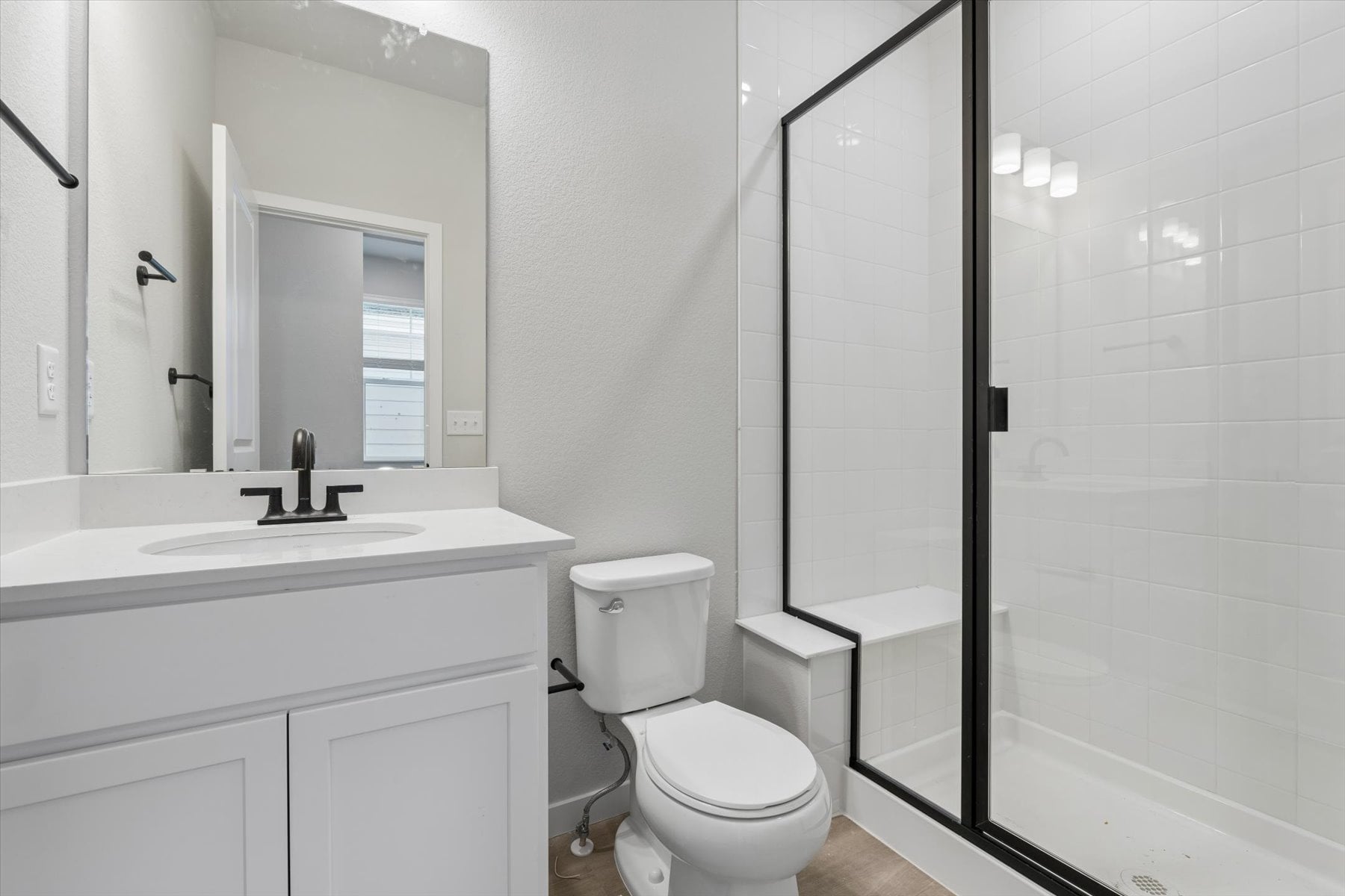 A bathroom with a glass shower.