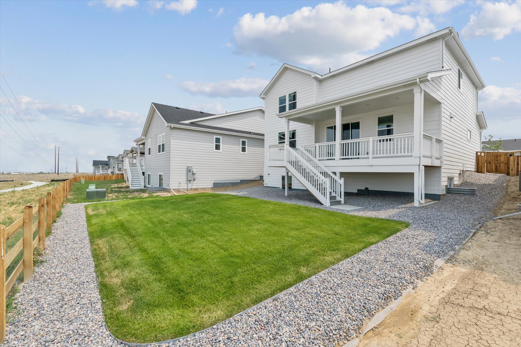A house with a green lawn.