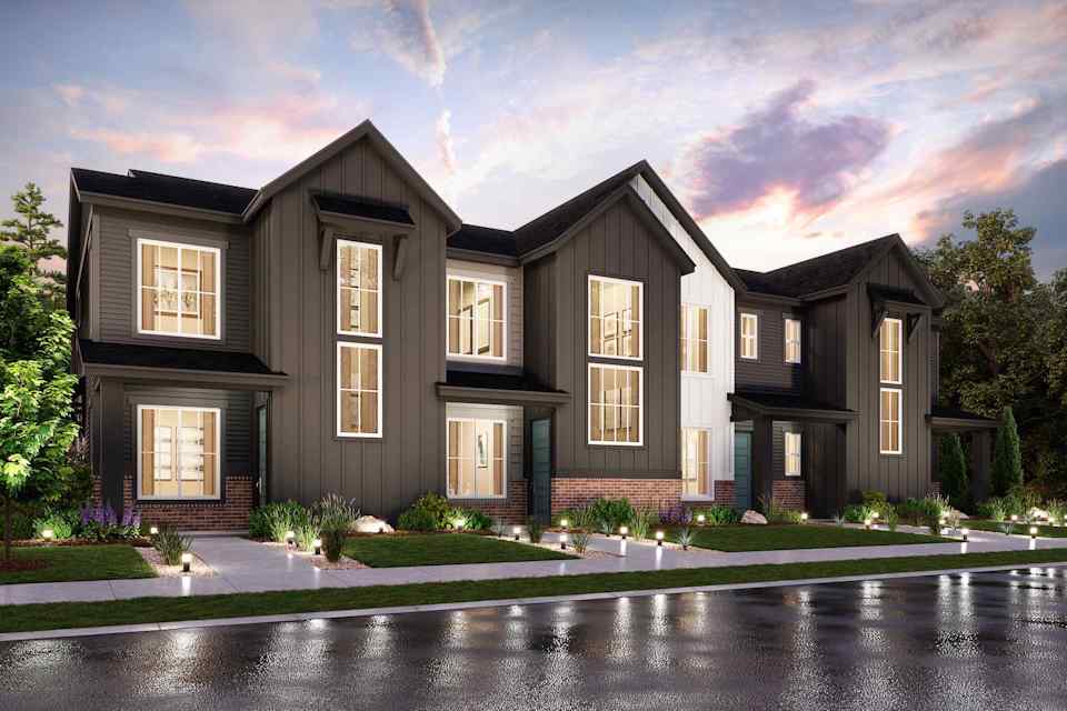 A large house with a pool in front of it.