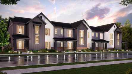 A large house with a pond in front of it.