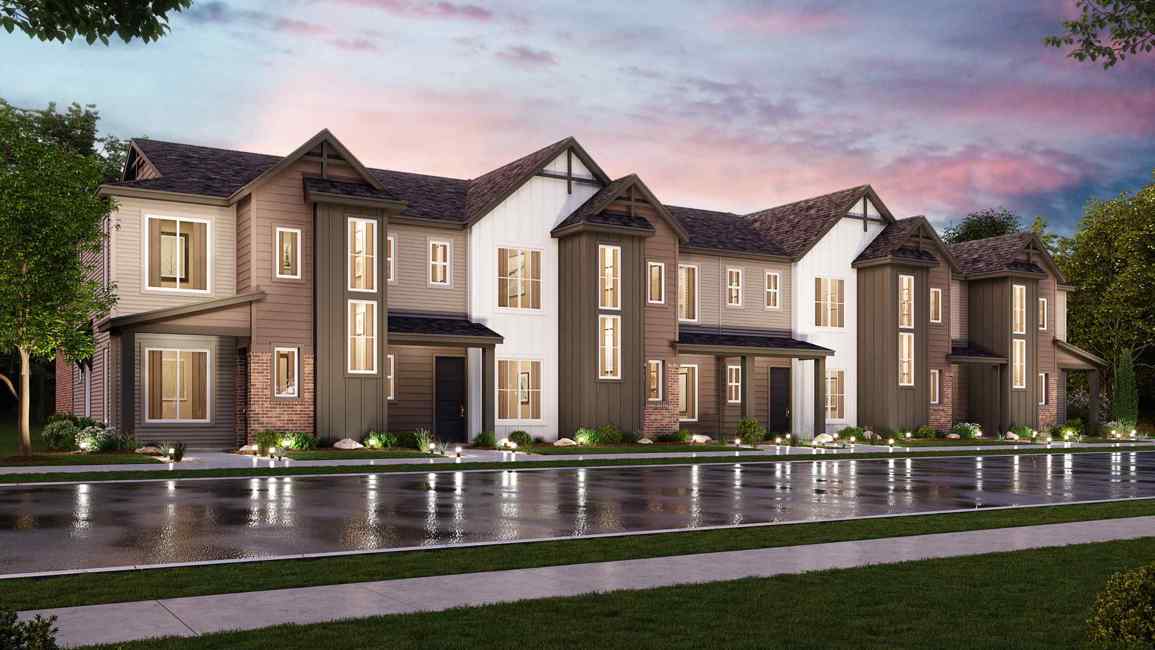 A large house with a pond in front of it.
