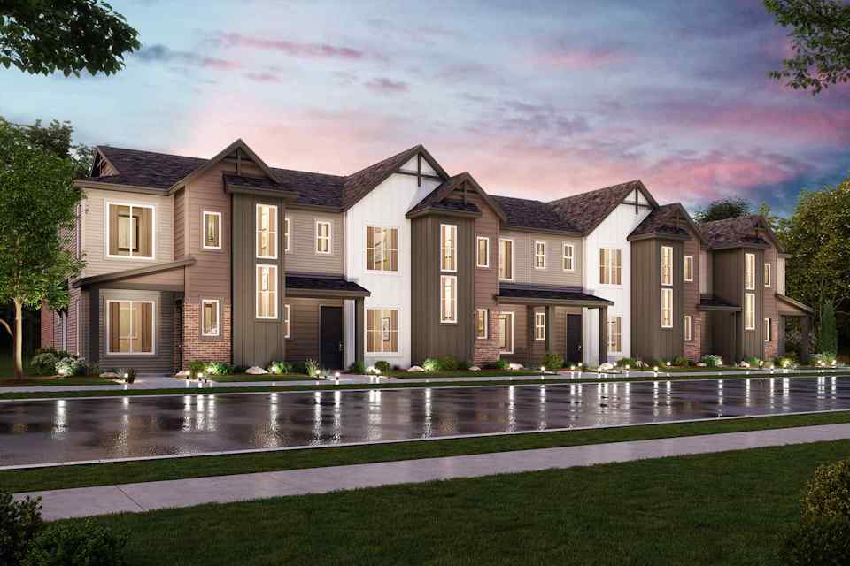 A large house with a pond in front of it.