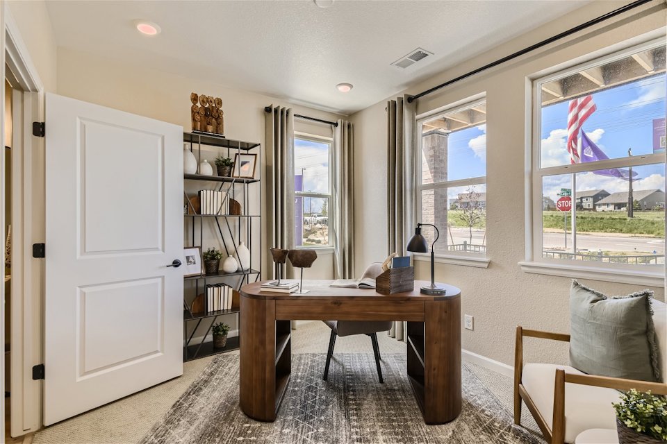 A room with a table and shelves.