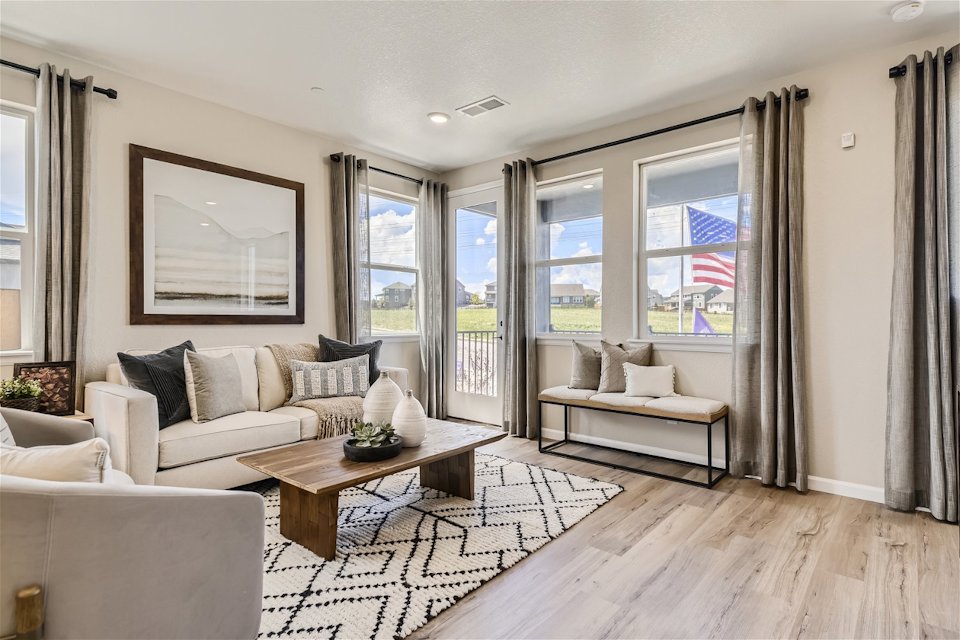 A living room with a large window.