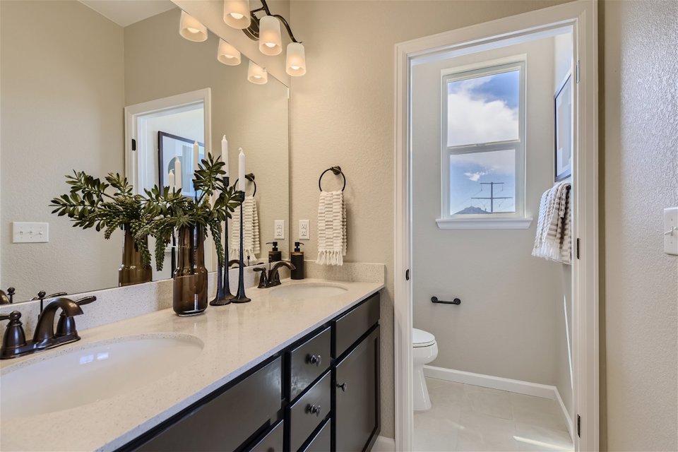 A bathroom with a marble countertop.