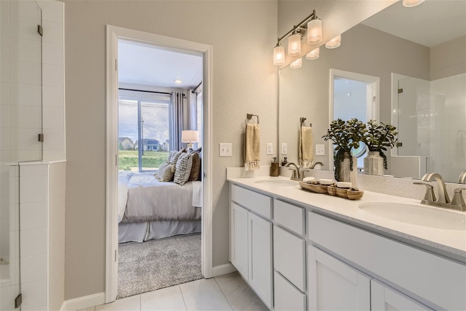 A bathroom with a large mirror.