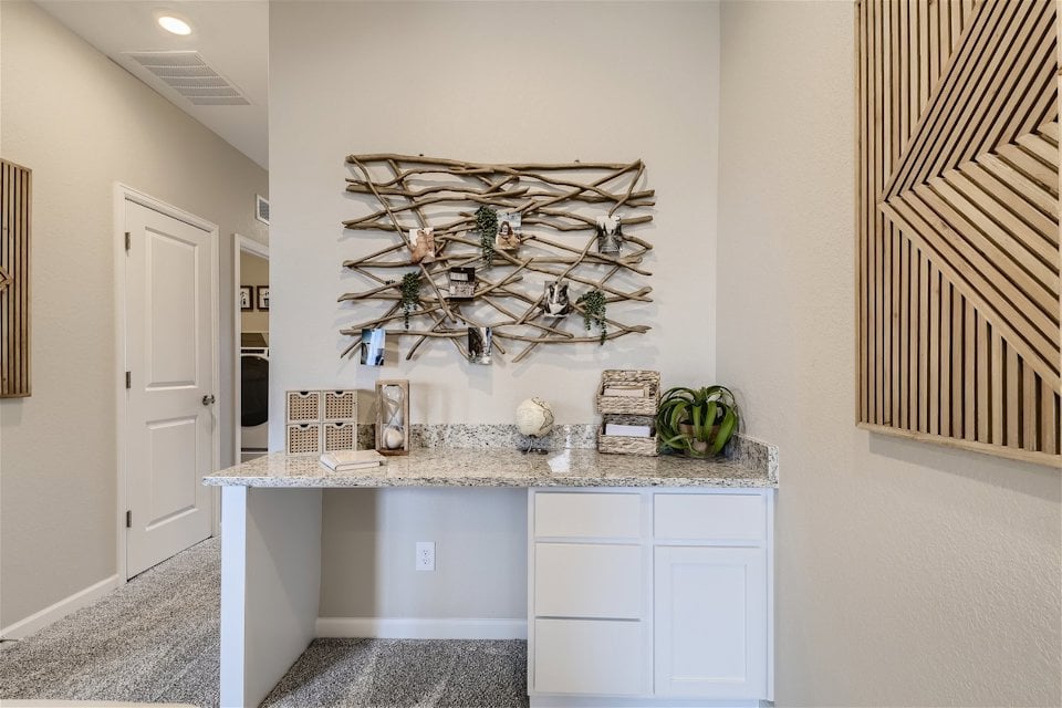 A kitchen with a marble countertop.