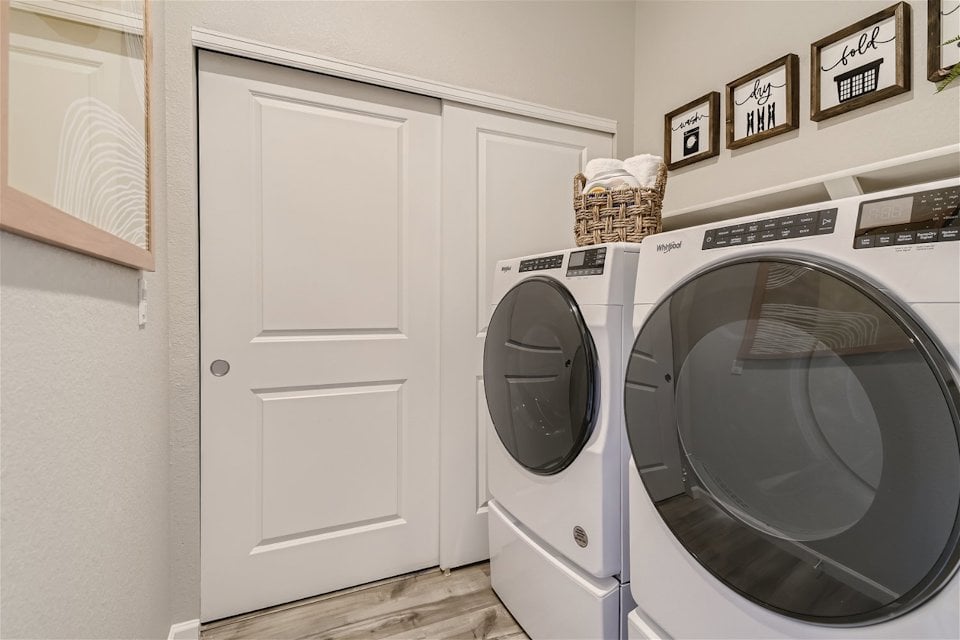 A washing machine in a room.