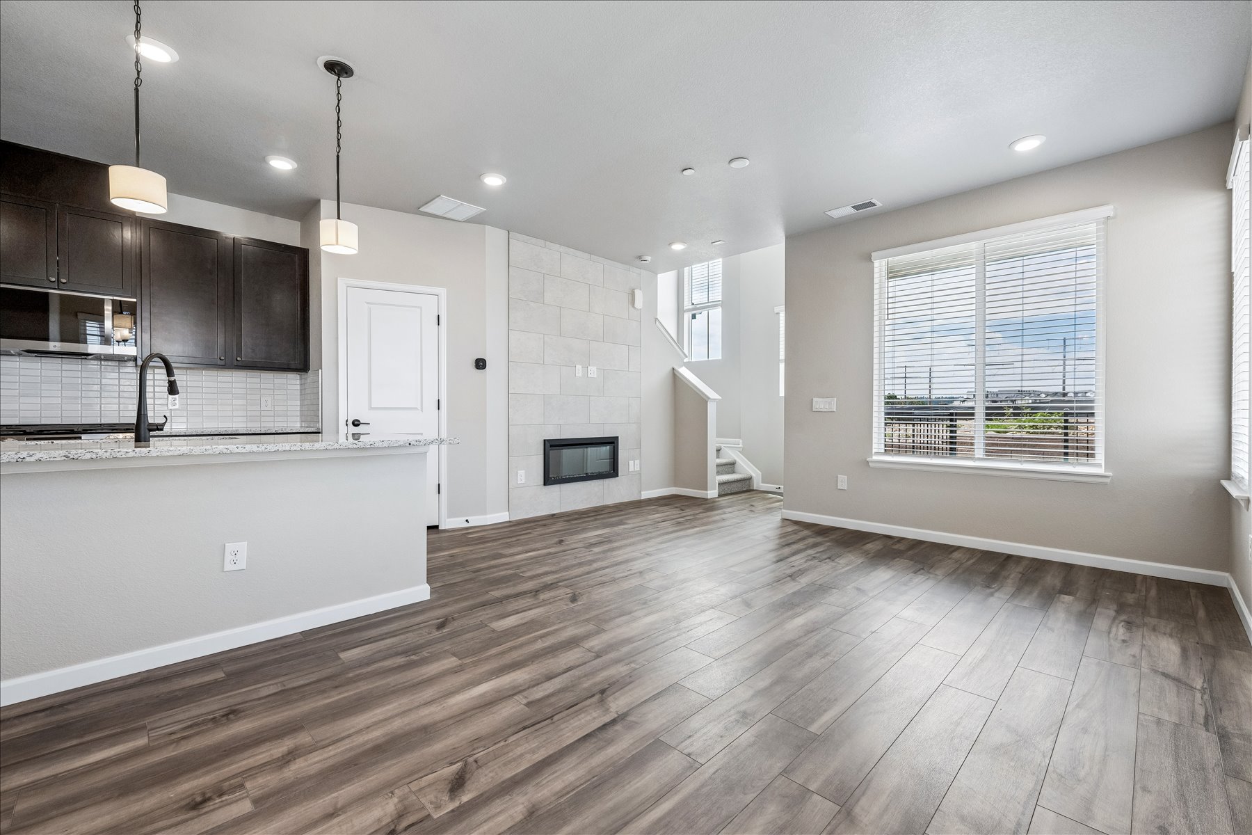 A kitchen with a wood floor.
