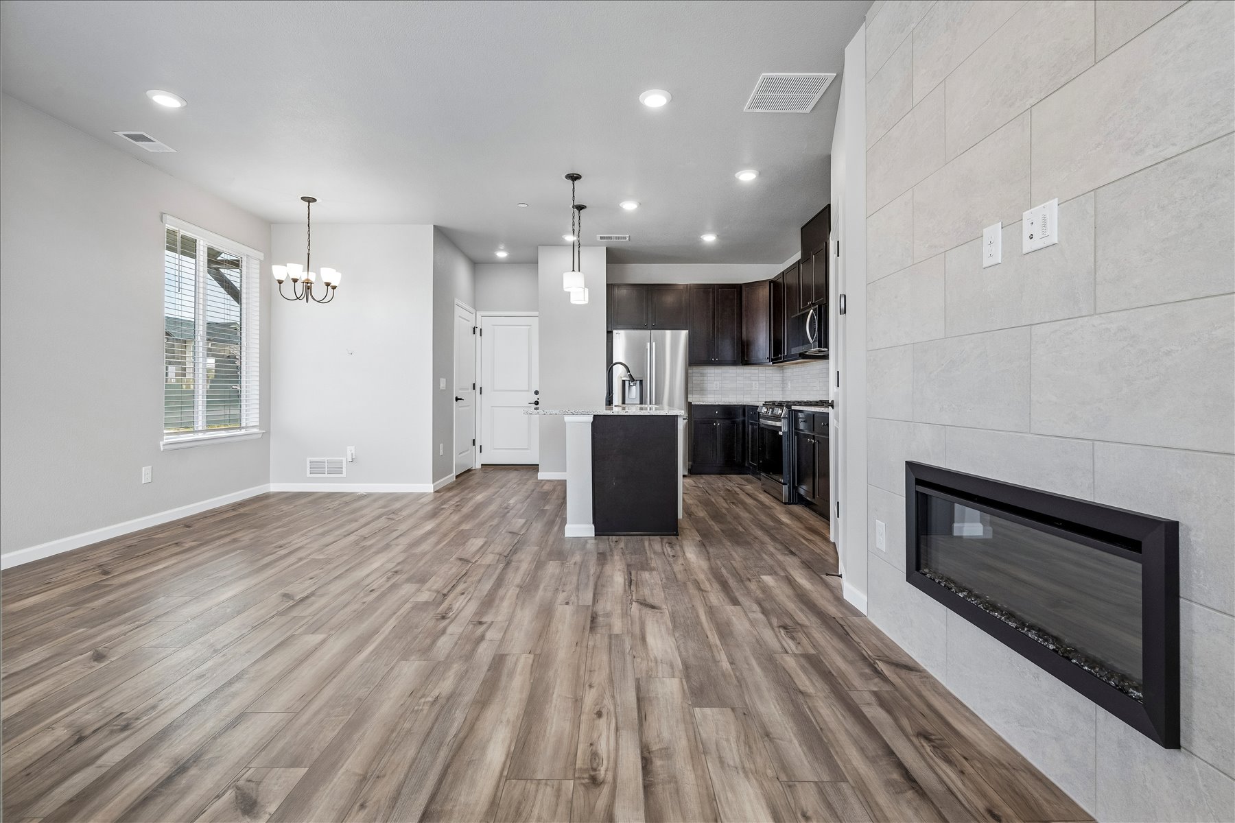 A large kitchen with a fireplace.