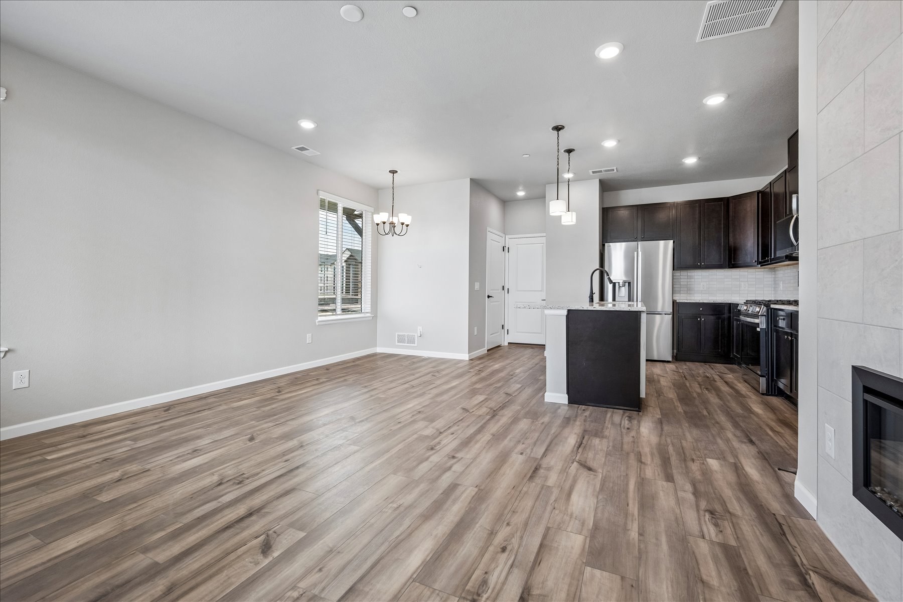 A kitchen with wooden floors.