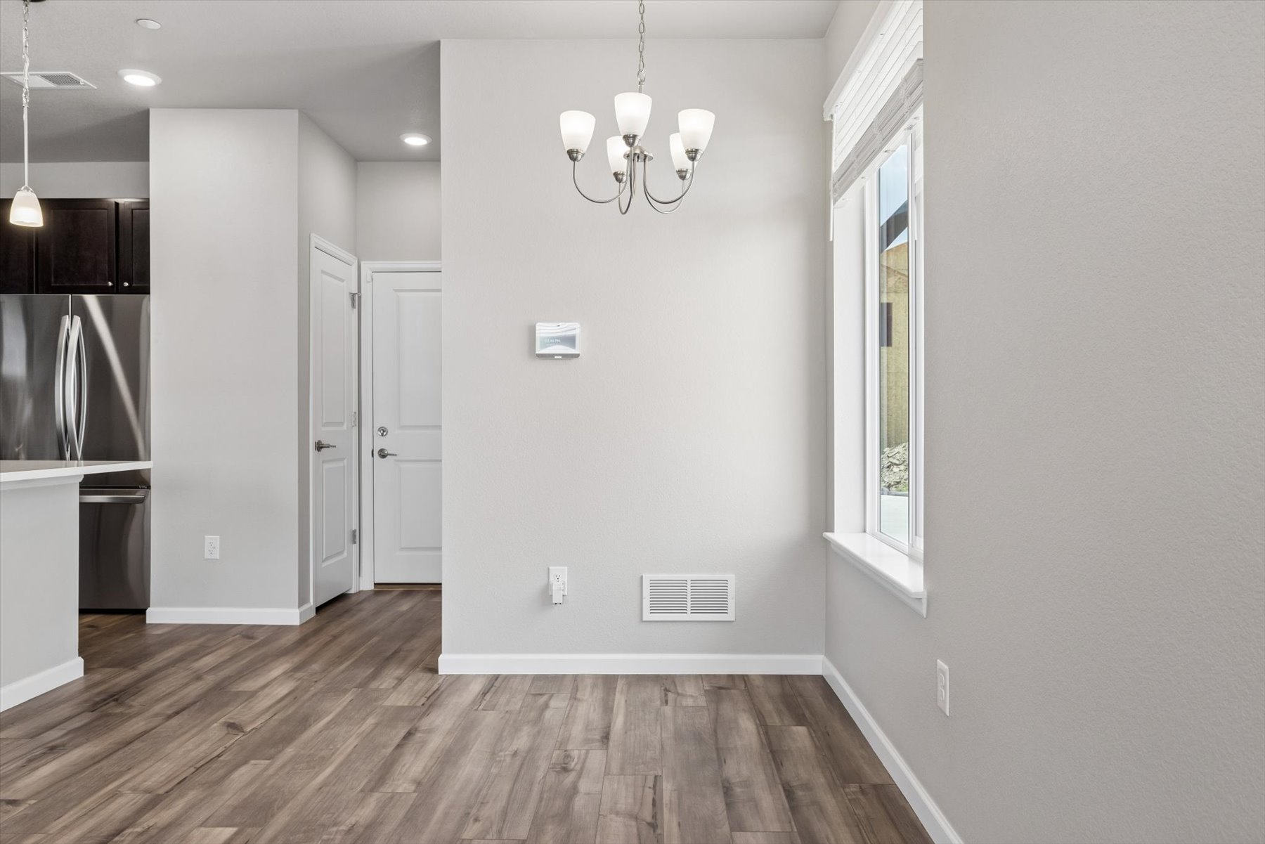 A kitchen with white walls.