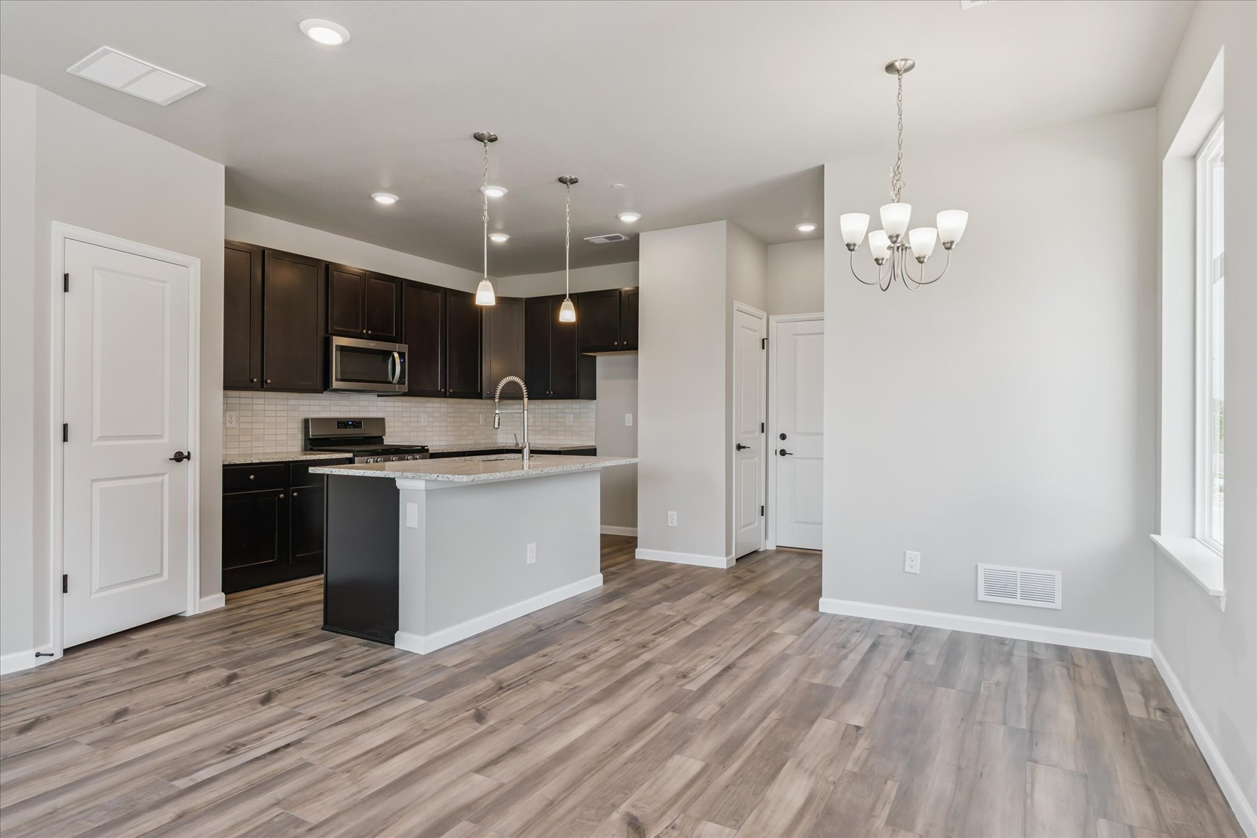 A kitchen with wooden floors.