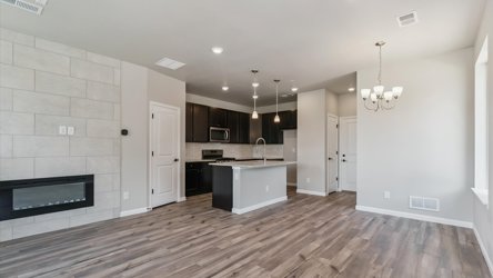 A kitchen with white walls.