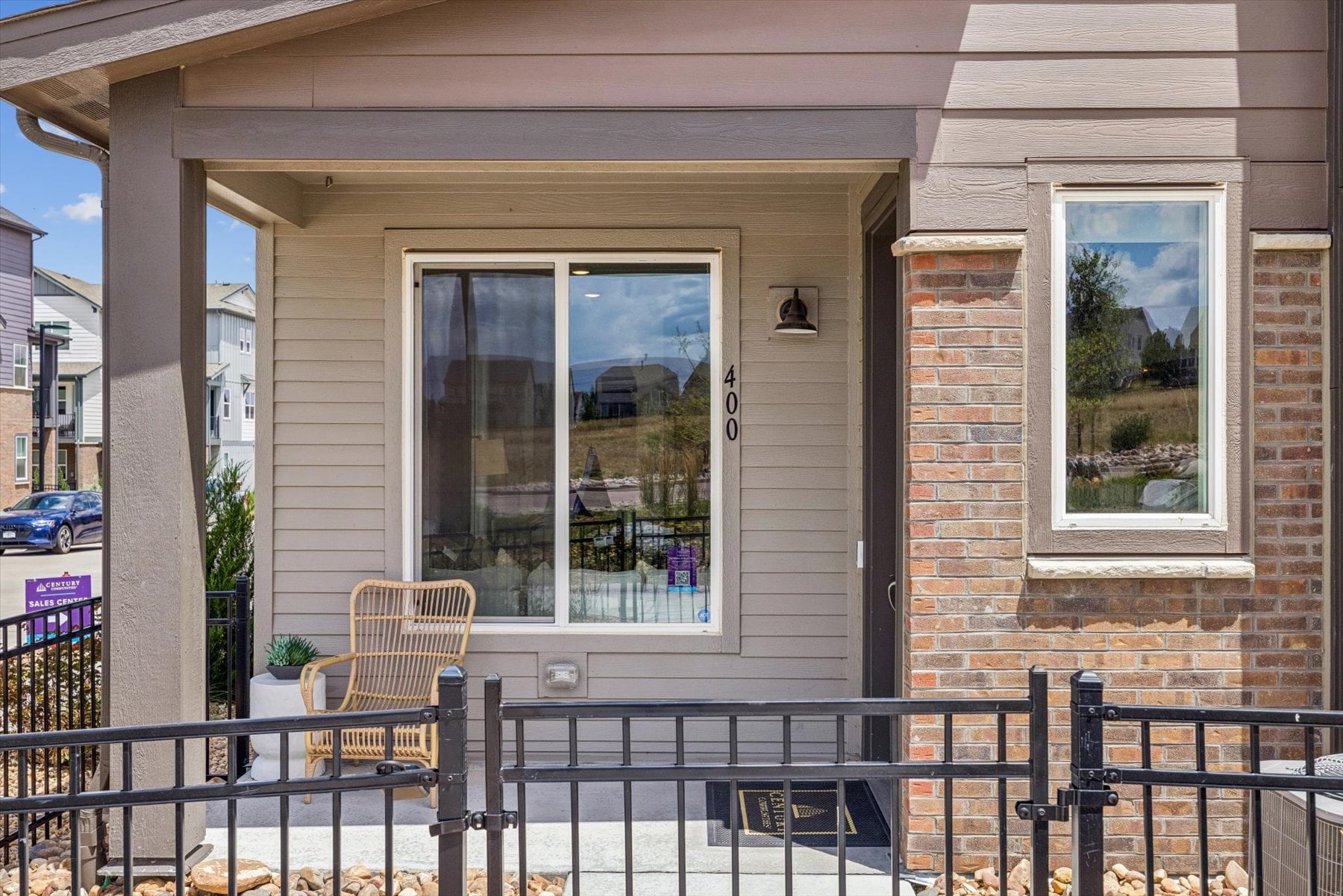 A house with a patio and a table and chairs.