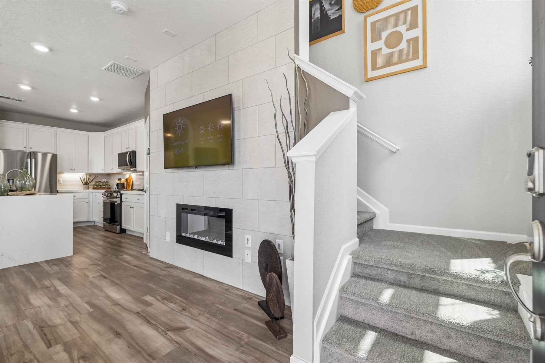 A kitchen with a fireplace.