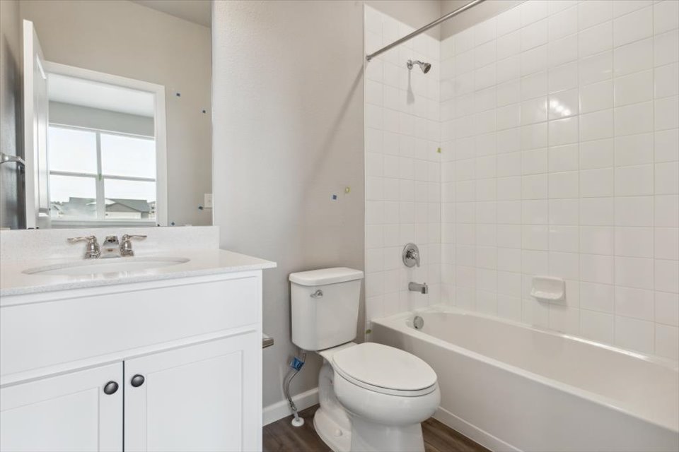 A bathroom with a toilet and sink.