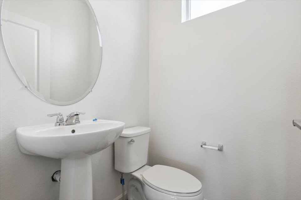 A bathroom with a sink and toilet.