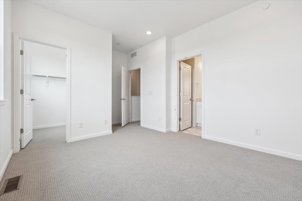 A long hallway with white walls.