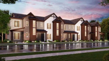 A large house with a pond in front of it.