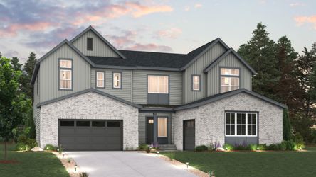 A grey house with a driveway.