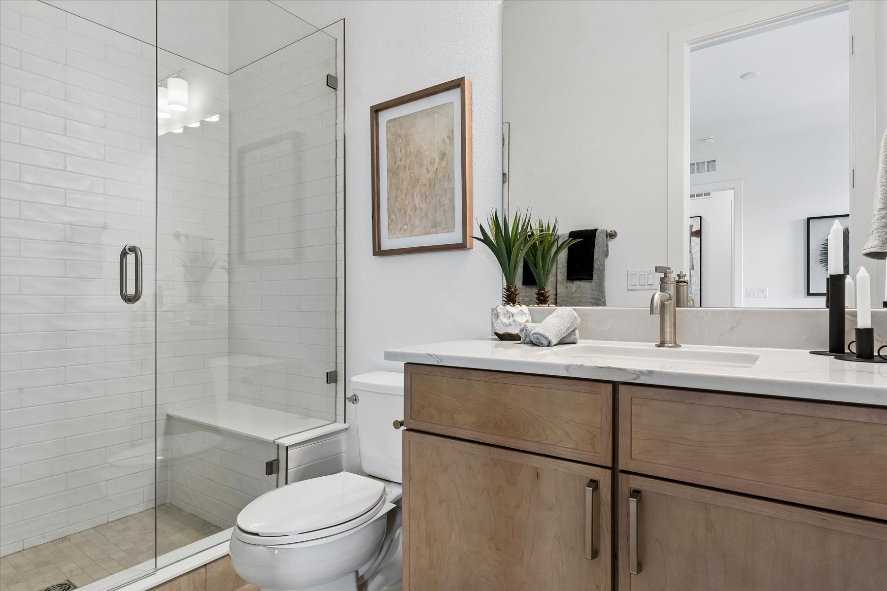 A bathroom with a glass shower.