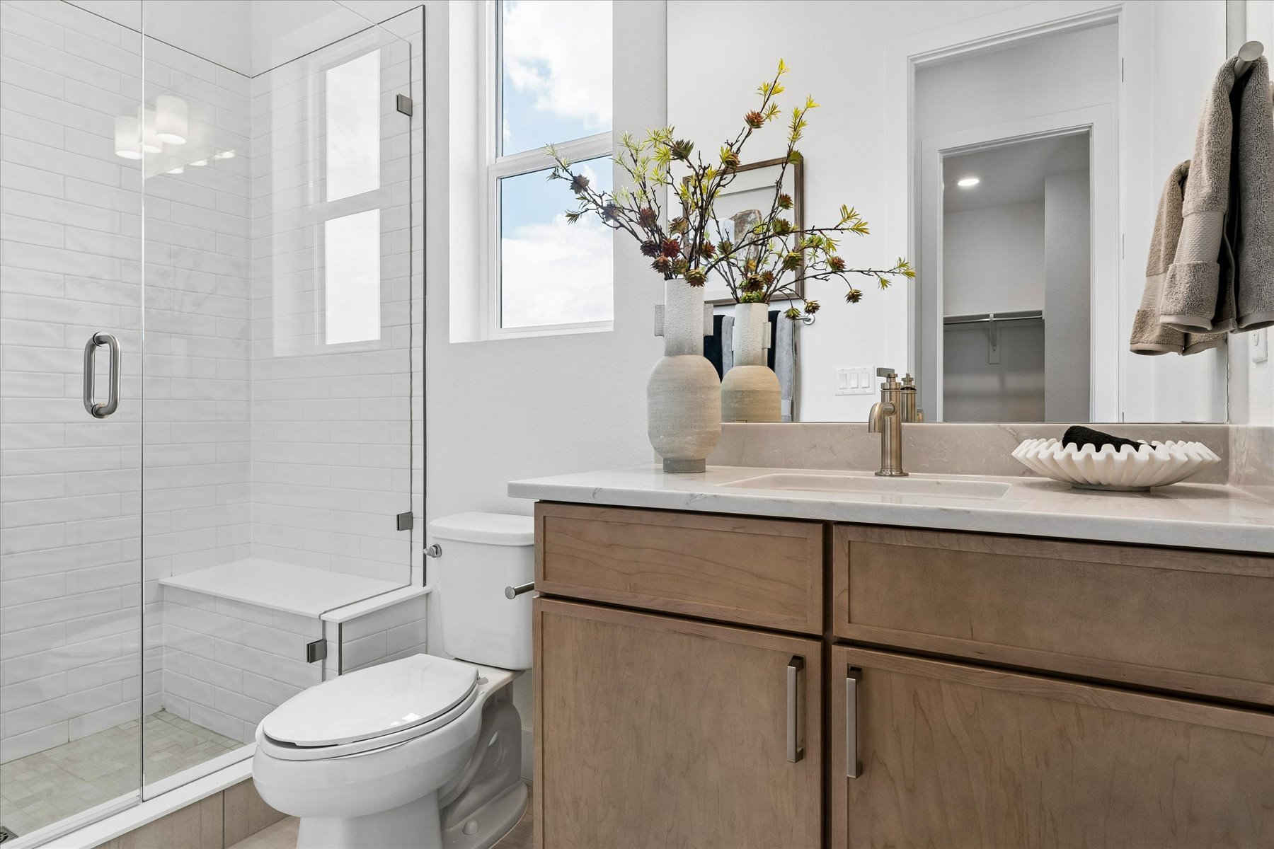 A bathroom with a sink toilet and a bathtub.