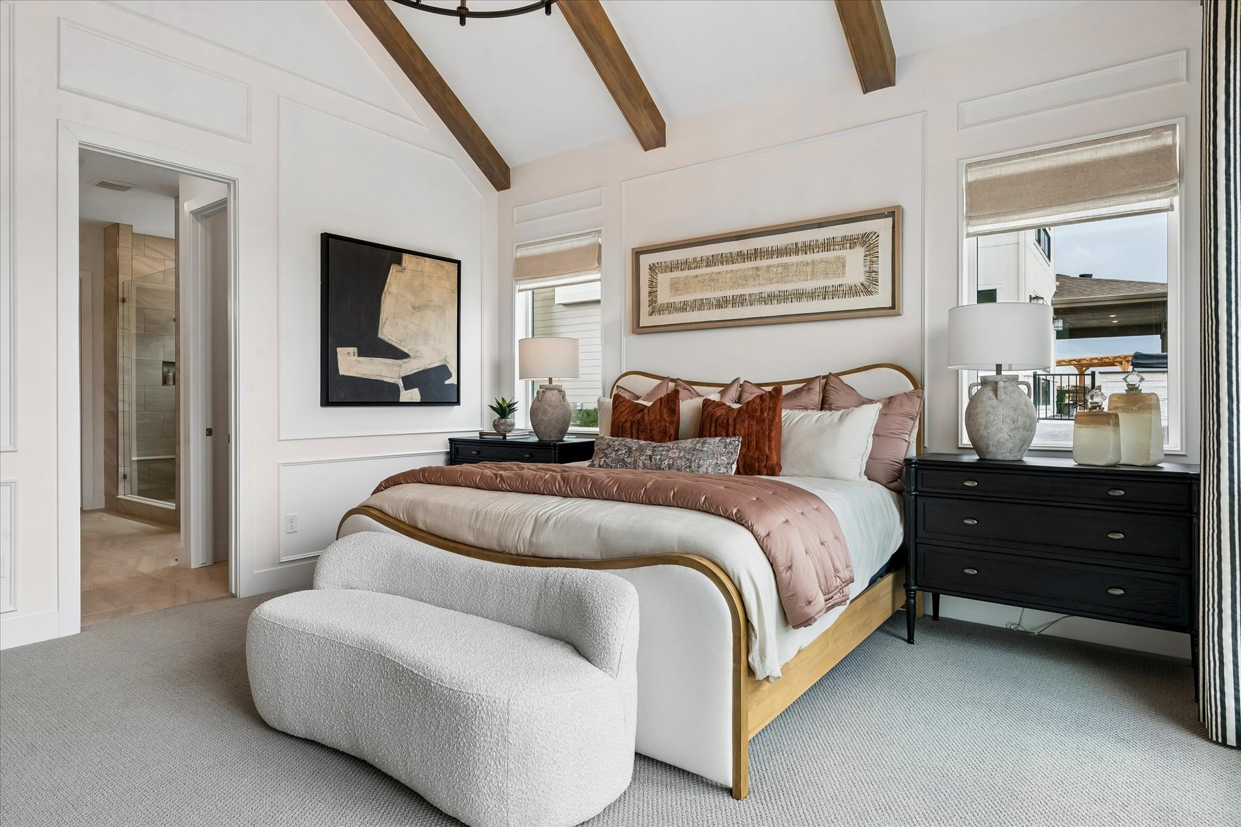 A bedroom with a bed and a dresser.