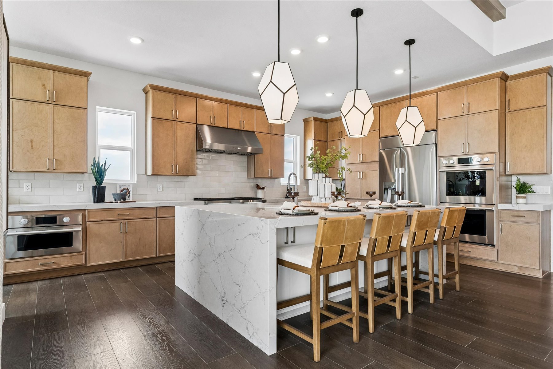 A kitchen with a wood floor.