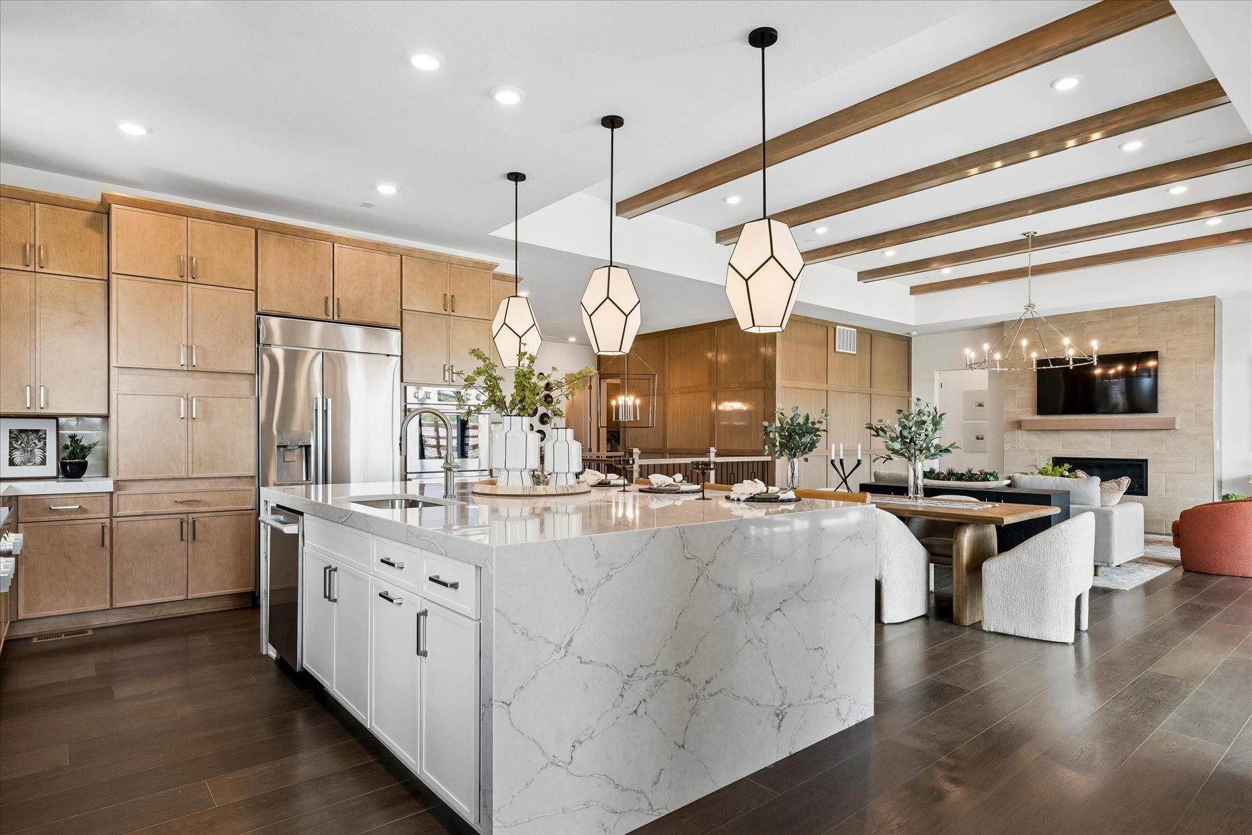 A kitchen with a bar and a dining table.