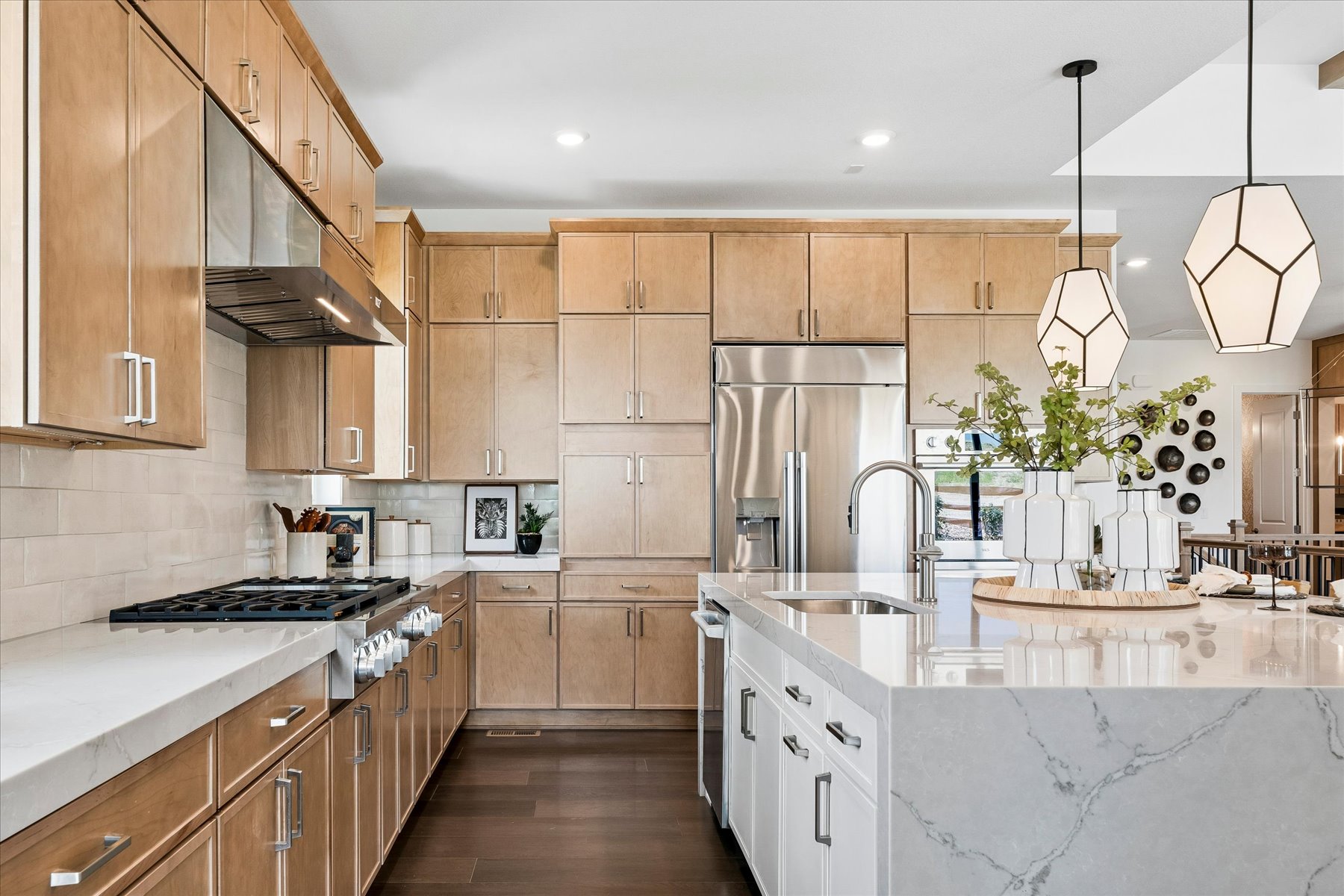 A kitchen with wooden cabinets.