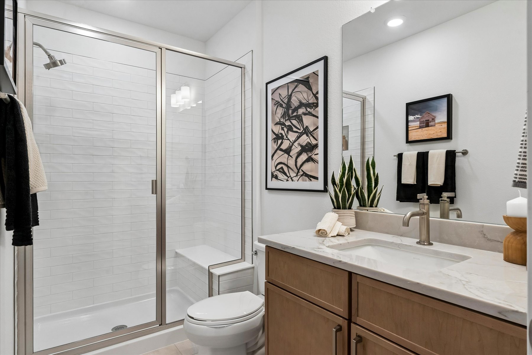 A bathroom with a shower and toilet.