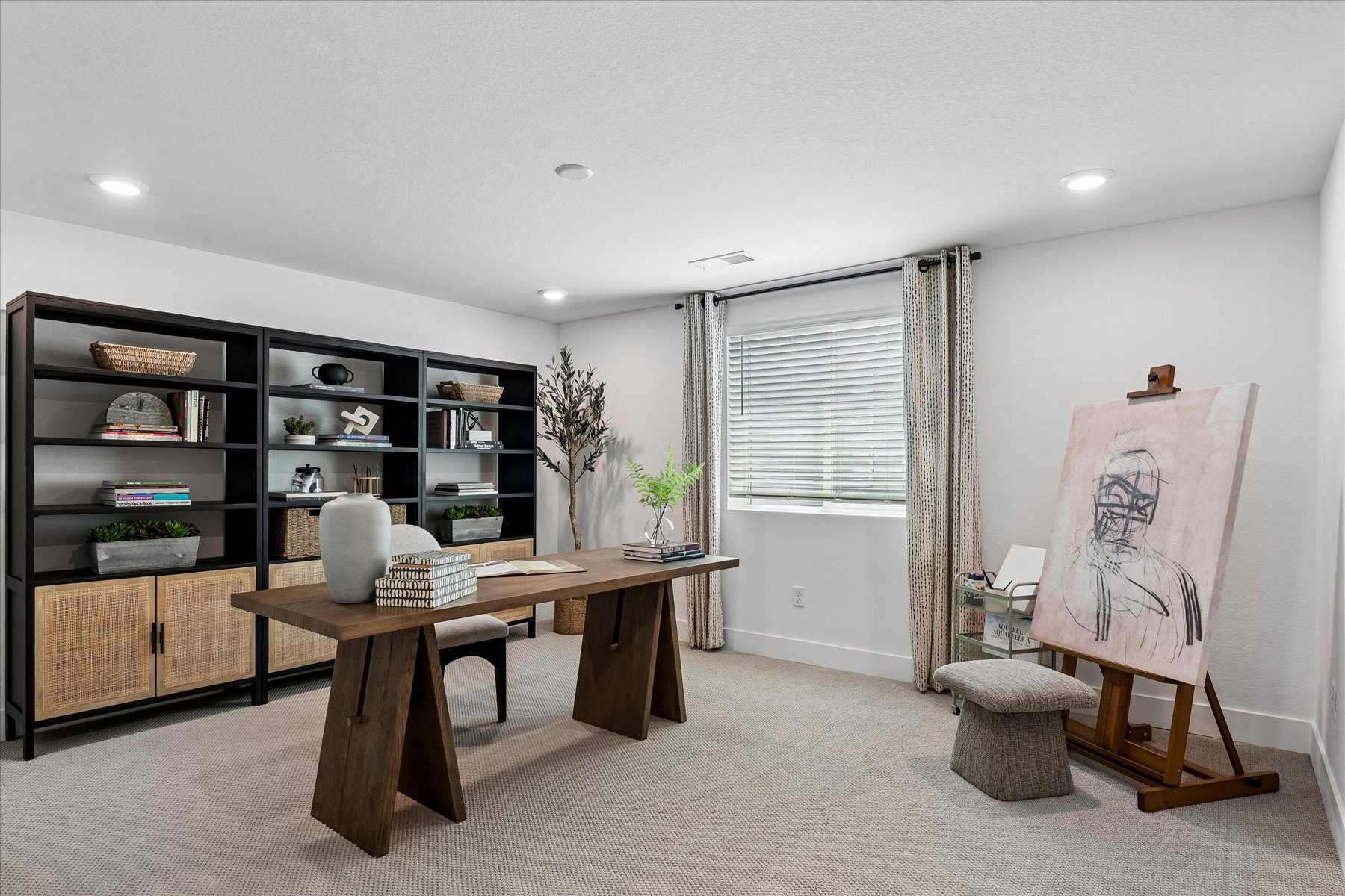 A room with a table and shelves.