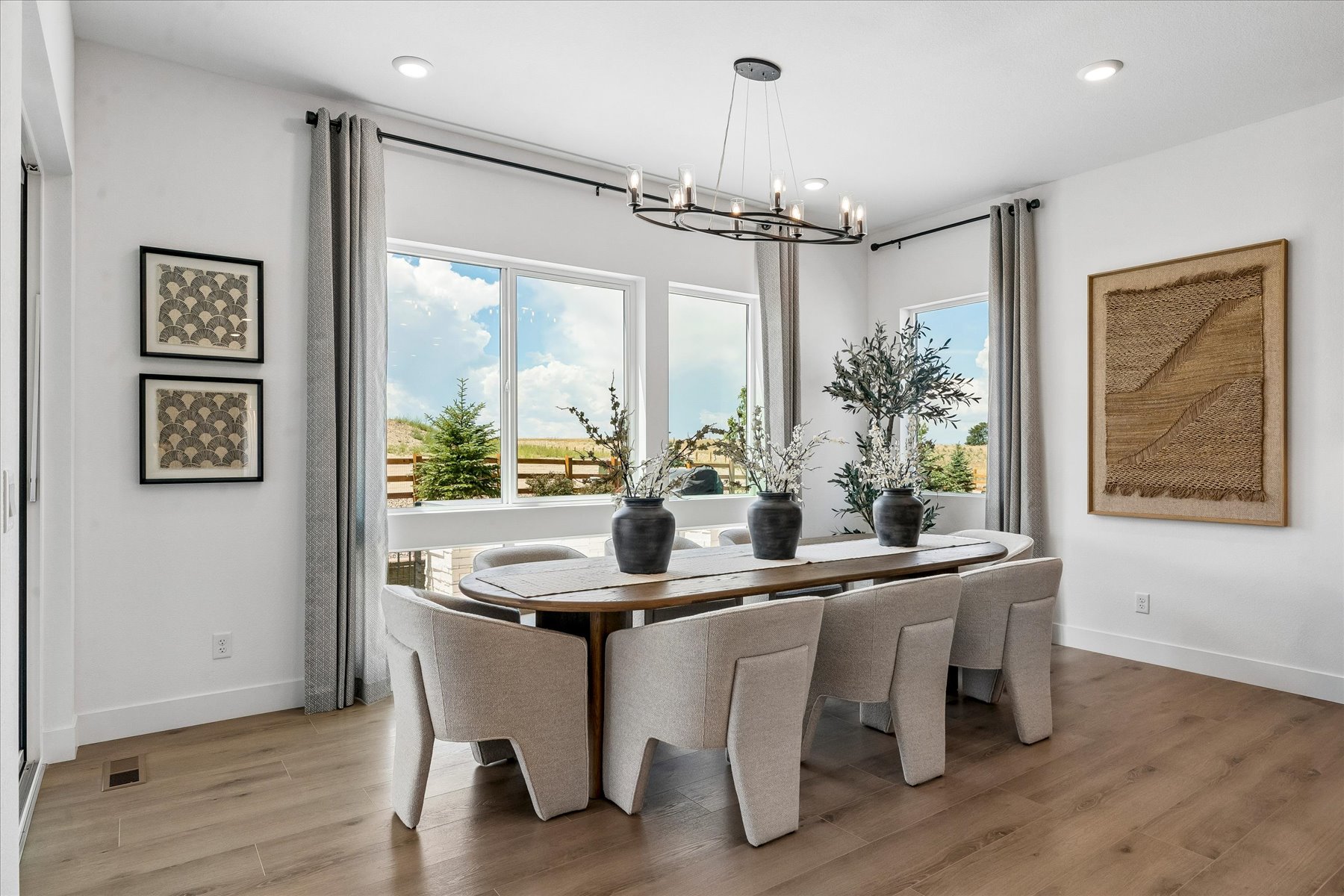 A dining room with a large window.