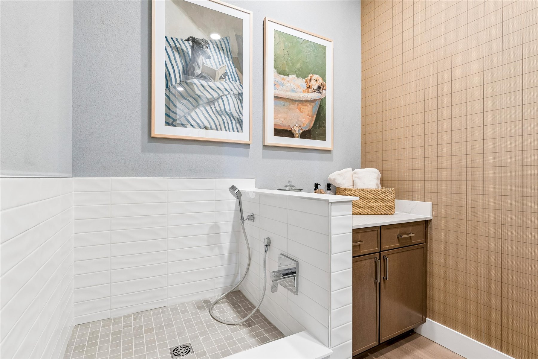 A bathroom with a shower and a sink.