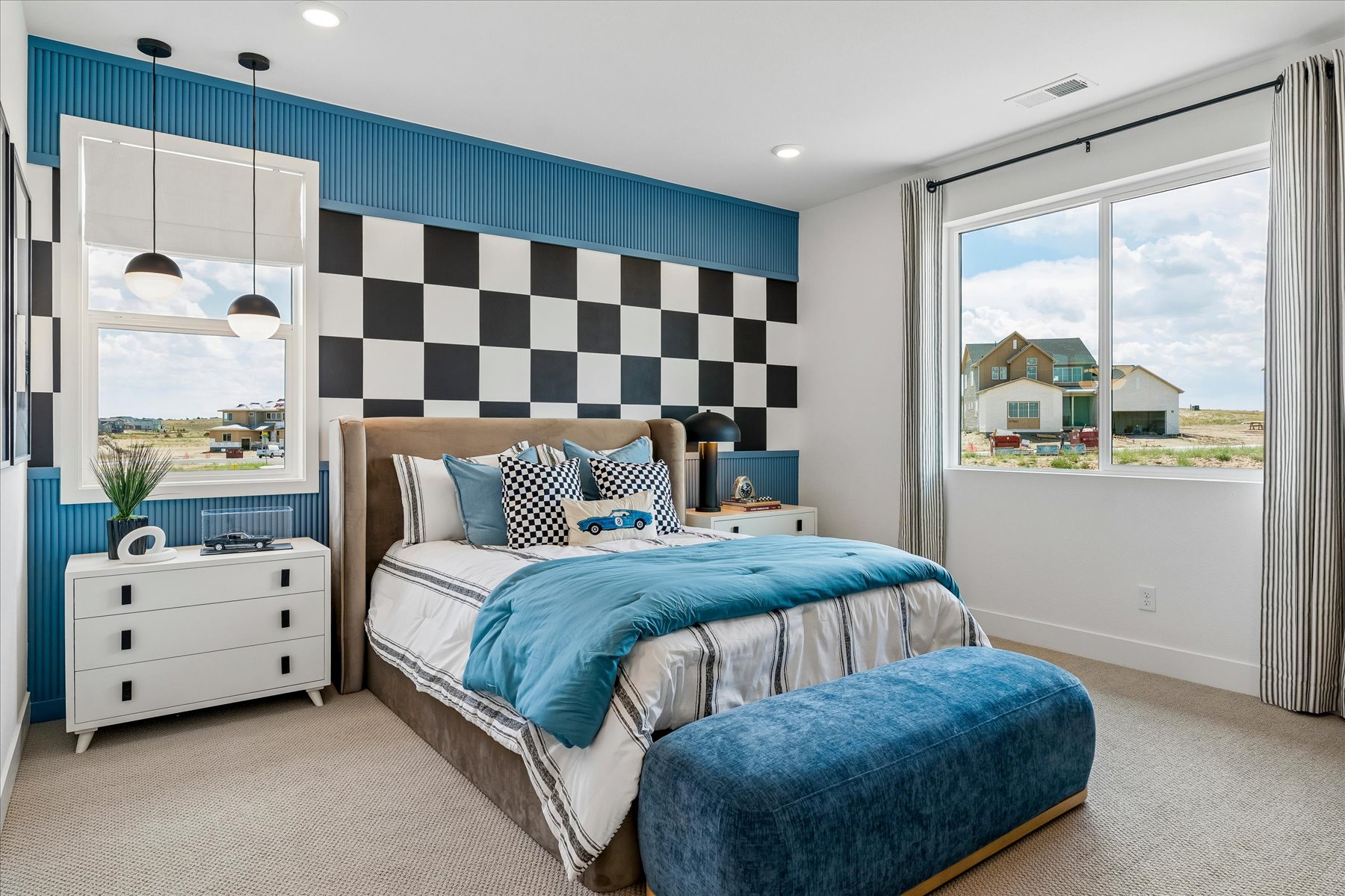 A bedroom with a bed and a window.